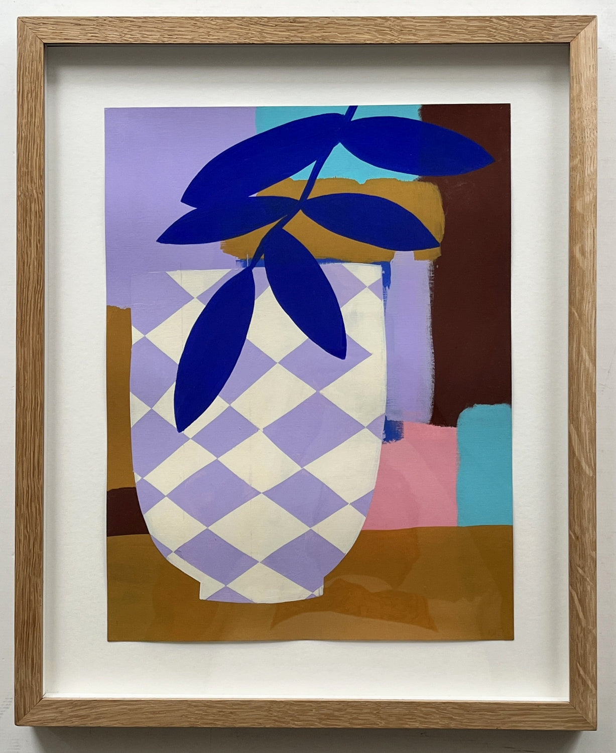 Framed artwork of a checkered vase with blue leaves on a colorful background